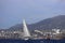 Sailboats sail in windy weather in the blue waters of the Aegean Sea