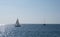 Sailboats sailing in the Cantabrian Sea in front of La Concha Bay, City of Donostia-San Sebastian in Euskadi