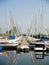 Sailboats in slips at dock