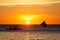 Sailboats at sunset on a tropical sea. Silhouette photo.