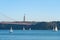 Sailboats on the Tagus River, 25 April Bridge background, Lisbon, Portugal