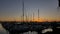 Sailboats Tethered at the Marina Dock at Sunset in San Diego California