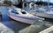 Sailboats tied up to the dock with ice forming around the boats