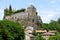 The Sailhant castle on top of a rocky outcrop overlooking the houses of the hamlet