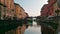 sailing along the Naviglio canal in Milan at sunset