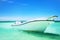 Sailing boat in the blue carribean sea and beautiful cloudscape