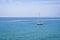 Sailing boat on blue mediterranean sea water