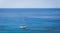 Sailing boat on blue mediterranean water in Ibiza island