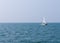 Sailing boat on the clear sea