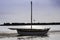 Sailing boat in dry, low tide, Adriatic Italy
