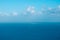 Sailing boat far away on ocean horizon, seascape aerial