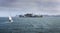 Sailing boat in front of prison island Alcatraz in bay of San Francisco, USA