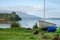 Sailing boat and kayaks at Lake Tarawera, New Zealand