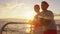 Sailing boat - Romantic couple enjoying ocean sunset on small cruise ship