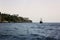 Sailing boat in the sea in the coastline