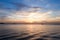 Sailing boat silhouette over sunset sky