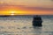 Sailing boat during sunset on the public beach of Albion,Mauritius.