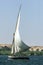 A sailing boat travels down the River Nile near Edfu in Egypt.