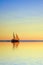 Sailing Boat on a Tropical Ocean at Twilight