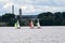 Sailing boat yacht or sailboat group regatta race on sea or ocean water. Panoramic view.