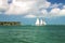 Sailing boat and yachts on tropical sea water, Sunset Key island in Key West, Florida Keys