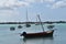 Sailing boats at the anchorage in a tropical bay. Vacation background.