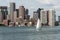 Sailing boats on the Charles River in front of Boston Skyline in Massachusetts USA on a sunny summer day