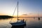 Sailing boats coming back into the harbor during beautiful sunset