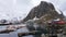 Sailing boats in Hamnoy harbour at Reinefjorden on the Lofoten in Norway in winter