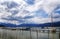 Sailing boats on the jetty in the tegernsee lake, snow-covered m