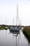Sailing Boats Moored at Upton, River Bure, Upton Great Broad, Norfolk Broads, near Acle, Norfolk, England, UK