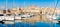 Sailing boats on Senglea marina in Grand Bay, Valetta, Malta, on a bright day with blue sly. Panoramic image of super marina in