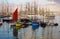 Sailing boats and stand in port