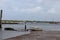 Sailing boats on the waters edge Brancaster east coast England at low tide