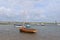 Sailing boats on the waters edge Brancaster east coast England at low tide