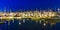 sailing boats in the windless Monterey harbor at the pier by night