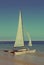 Sailing catamaran on beach - vintage retro style