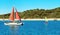 Sailing Catamaran with red sails at Second Beach, Great Keppel Island, Great Barrier Reef, Queensland