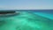 Sailing catamaran, sailboats and speed boats in the ocean. Aerial view over Caribbean sea.