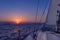 Sailing in the dusk in the Aegean sea, Greece, with beautiful sunset colors