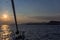 Sailing at dusk towards cape Sounio, Greece