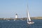 Sailing in Edgartown Harbor by Lighthouse on the Island of Martha`s Vineyard