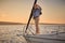 Sailing man on yacht. Elegant senior man standing on the side of a sailboat or yacht deck floating in sea, looking at