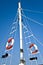 Sailing mast with life buoy