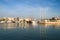 Sailing, motor boats and a small fishing boat crossing calm waters in the harbor of marina Zeas .Pireas.Greece.