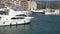 Sailing and motor yachts are moored at the Lustica bay marina