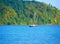 Sailing n the Caribbean sea ocean on yacht boat with mountains in sight - Jamaica