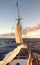 Sailing old schooner at sunset, travel and adventure concept