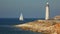 Sailing race on the background of the lighthouse