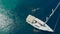 Sailing regatta, boat trip, top view. White yacht in the blue sea